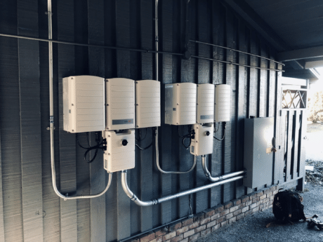 solar batteries on wall outside house