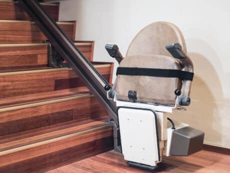 Stair lift in home for use by disabled persons
